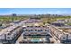 Aerial view of newly built townhomes, showcasing the community pool and stunning Phoenix cityscape in the distance at 377 E Windsor Ave # 16, Phoenix, AZ 85004