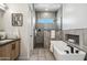 Contemporary bathroom featuring a freestanding tub, walk-in shower, and modern gray tile at 377 E Windsor Ave # 16, Phoenix, AZ 85004