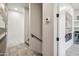 Hallway with modern tile and stairway, flowing into an entertainment area with wet bar at 377 E Windsor Ave # 16, Phoenix, AZ 85004