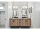 Dual vanity with modern cabinets, stone countertops and lighting in main bathroom at 377 E Windsor Ave # 16, Phoenix, AZ 85004