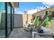 Private outdoor patio with a seating area and lush vertical garden at 377 E Windsor Ave # 16, Phoenix, AZ 85004