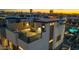 Aerial view of a townhome's rooftop deck featuring an outdoor dining and seating area at 377 E Windsor Ave # 16, Phoenix, AZ 85004