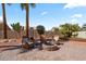 Backyard patio featuring a fire pit and comfortable seating for outdoor enjoyment at 4068 N 155Th Ln, Goodyear, AZ 85395