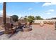 Landscaped backyard featuring seating around a fire pit at 4068 N 155Th Ln, Goodyear, AZ 85395