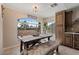 Bright dining area featuring a large window and charming decor and a view to the back yard at 4068 N 155Th Ln, Goodyear, AZ 85395