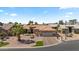 Beautiful single-story home with a three-car garage, a tile roof, and low maintenance desert landscaping at 4068 N 155Th Ln, Goodyear, AZ 85395