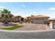 A charming single-story home with well-maintained landscaping and a brick driveway at 4068 N 155Th Ln, Goodyear, AZ 85395