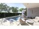 Inviting outdoor space featuring a luxurious pool, stylish patio furniture, and lush greenery for ultimate relaxation at 4215 N 34Th St, Phoenix, AZ 85018