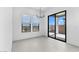 Dining room with modern lighting, a sliding glass door, and tile flooring at 4395 N 203Rd Ave, Buckeye, AZ 85396