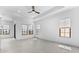 Open and airy living room with ample natural light and tile flooring at 4395 N 203Rd Ave, Buckeye, AZ 85396