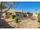 Beautiful backyard featuring a bridge, gazebo, desert landscaping, and brick pavers at 4865 E Princess Dr, Mesa, AZ 85205