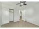 Bedroom featuring carpet, ceiling fan, and closet with open doors at 4865 E Princess Dr, Mesa, AZ 85205