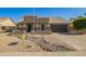 Charming home featuring desert landscaping, neutral colors, and an inviting entry way at 4865 E Princess Dr, Mesa, AZ 85205