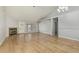 Spacious living room featuring vaulted ceiling, a fireplace, and wood-look flooring at 4865 E Princess Dr, Mesa, AZ 85205