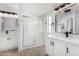 Bathroom with dual vanities, modern fixtures, and walk-in shower at 525 S 99Th St, Mesa, AZ 85208