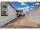 Exterior shot showing the side of the house and the dirt landscaping running the length of the house at 525 S 99Th St, Mesa, AZ 85208