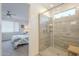 Ensuite bathroom with a glass-enclosed shower featuring modern fixtures and shelving at 5360 S 98Th Pl, Mesa, AZ 85212