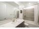 Well-lit bathroom featuring a spacious vanity with a marble countertop and a shower-tub combo with gray tiling at 5360 S 98Th Pl, Mesa, AZ 85212