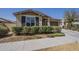 Attractive single-story home featuring a two-car garage and landscaped front yard at 5360 S 98Th Pl, Mesa, AZ 85212