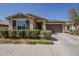 Charming single-story home with a well-maintained front yard and a two-car garage at 5360 S 98Th Pl, Mesa, AZ 85212