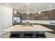 Bright kitchen boasting pendant lights over a quartz island, modern appliances, and ample cabinet space at 5360 S 98Th Pl, Mesa, AZ 85212