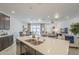 Spacious kitchen island with undermount sink, pendant lighting, and an open view to the living area at 5360 S 98Th Pl, Mesa, AZ 85212