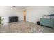 Sitting room with wood-look tile floors, neutral walls, and a decorative rug at 5360 S 98Th Pl, Mesa, AZ 85212