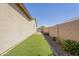 Low-maintenance side yard with artificial turf and gravel bed at 5360 S 98Th Pl, Mesa, AZ 85212