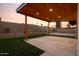 Outdoor patio features a wood ceiling, built-in lighting, artificial grass, and a concrete surface at 5449 E Cambridge Ave, Phoenix, AZ 85008