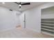 Bright bedroom featuring a ceiling fan and a closet with built-in shelving at 5449 E Cambridge Ave, Phoenix, AZ 85008