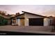 Contemporary home featuring a well-manicured front yard and a two-car garage at 5449 E Cambridge Ave, Phoenix, AZ 85008