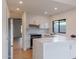 Modern kitchen featuring white cabinetry, stainless steel appliances, marble countertops, and a stylish faucet and sink at 5449 E Cambridge Ave, Phoenix, AZ 85008