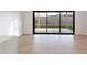 Bright living room features light wood floors and sliding glass doors to the backyard at 5449 E Cambridge Ave, Phoenix, AZ 85008