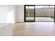 Bright and airy living space featuring light wood floors and large sliding glass doors to the backyard at 5449 E Cambridge Ave, Phoenix, AZ 85008