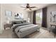Serene bedroom with soft natural light, ceiling fan, and luxurious bedding at 560 E Rainbow Dr, Chandler, AZ 85249