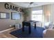 Stylish game room features a foosball table, a large TV, comfortable seating, and playful decor, perfect for entertainment at 624 N Vine St, Chandler, AZ 85225