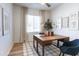 Bright home office features a wooden desk, neutral walls, and a window that allows for natural light to fill the space at 624 N Vine St, Chandler, AZ 85225