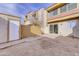 Enclosed backyard patio with a storage shed and view of the back of the condo building at 6333 N 49Th Ave, Glendale, AZ 85301