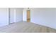 The bright bedroom features new light-colored floors and white trim at 6333 N 49Th Ave, Glendale, AZ 85301