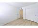 Bright bedroom with new light-colored floors, white trim, and a closet with sliding doors at 6333 N 49Th Ave, Glendale, AZ 85301