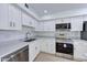 Bright kitchen featuring stainless steel appliances and white cabinets, offering a modern and clean aesthetic at 6333 N 49Th Ave, Glendale, AZ 85301