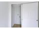 Bright laundry room features white walls, light-colored floor, and sliding white door at 6333 N 49Th Ave, Glendale, AZ 85301