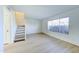 Inviting living room with natural light, wood-look floors, and staircase access to the upper level at 6333 N 49Th Ave, Glendale, AZ 85301