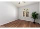 Empty bedroom with modern ceiling fan and plantation shutters at 7118 E Juanita Ave, Mesa, AZ 85209