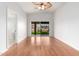 Bright bedroom features hardwood floors, modern ceiling fan, and sliding glass door to the backyard at 7118 E Juanita Ave, Mesa, AZ 85209