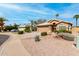 Charming single story home with well-maintained landscaping and a two-car garage at 7118 E Juanita Ave, Mesa, AZ 85209