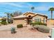 Inviting front exterior featuring desert landscaping and a tile roof at 7118 E Juanita Ave, Mesa, AZ 85209