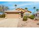 Charming single-story home featuring a tile roof, well-manicured landscaping, and a two-car garage at 7118 E Juanita Ave, Mesa, AZ 85209