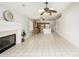 Open-concept living room with tile floors and view of the kitchen with modern appliances at 7118 E Juanita Ave, Mesa, AZ 85209