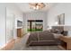 Cozy main bedroom featuring a sliding door with backyard views at 7118 E Juanita Ave, Mesa, AZ 85209